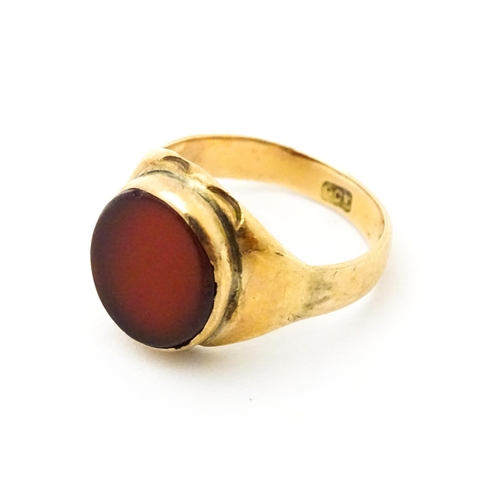 624 - A 9ct gold signet ring set with central carnelian. Ring size approx. I 1/2