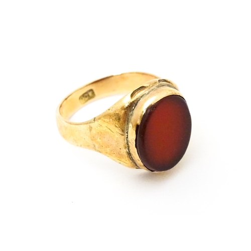 624 - A 9ct gold signet ring set with central carnelian. Ring size approx. I 1/2