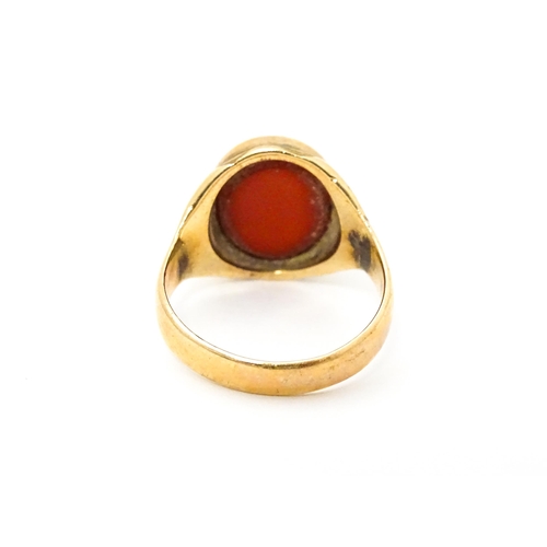 624 - A 9ct gold signet ring set with central carnelian. Ring size approx. I 1/2