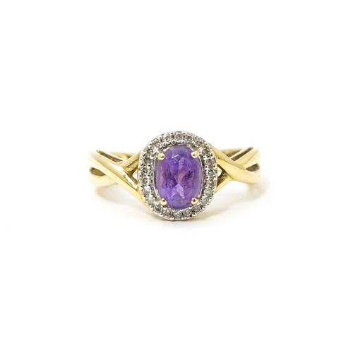 625 - A 9ct gold ring set with amethyst and diamond. Ring size approx. K 1/2