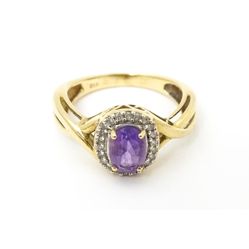 625 - A 9ct gold ring set with amethyst and diamond. Ring size approx. K 1/2