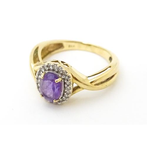 625 - A 9ct gold ring set with amethyst and diamond. Ring size approx. K 1/2