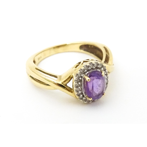 625 - A 9ct gold ring set with amethyst and diamond. Ring size approx. K 1/2