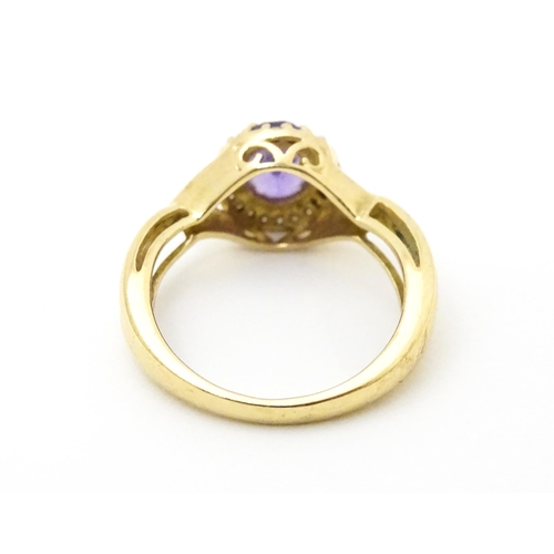 625 - A 9ct gold ring set with amethyst and diamond. Ring size approx. K 1/2