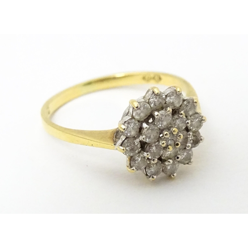 631 - An 18ct gold ring set with diamond cluster. Ring size approx. J 1/2