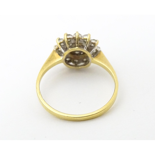 631 - An 18ct gold ring set with diamond cluster. Ring size approx. J 1/2