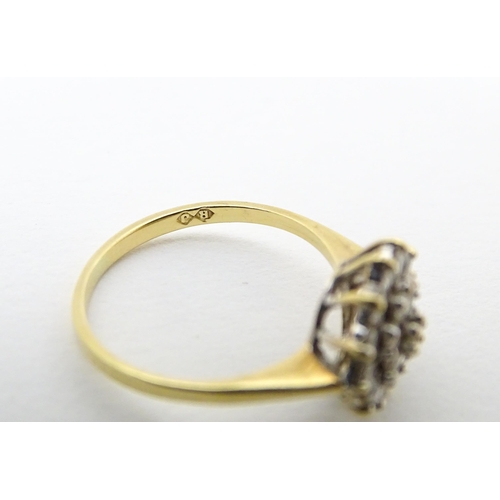 631 - An 18ct gold ring set with diamond cluster. Ring size approx. J 1/2