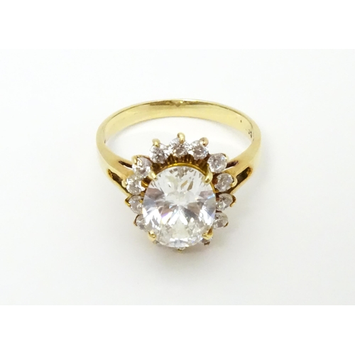 632 - A yellow metal ring set with white stones. Ring size approx. N