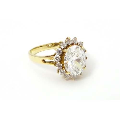 632 - A yellow metal ring set with white stones. Ring size approx. N