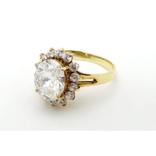 632 - A yellow metal ring set with white stones. Ring size approx. N