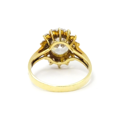 632 - A yellow metal ring set with white stones. Ring size approx. N