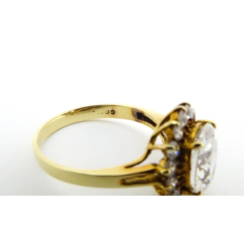 632 - A yellow metal ring set with white stones. Ring size approx. N