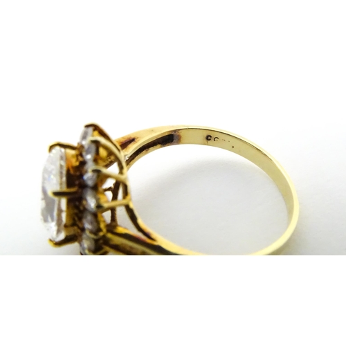 632 - A yellow metal ring set with white stones. Ring size approx. N