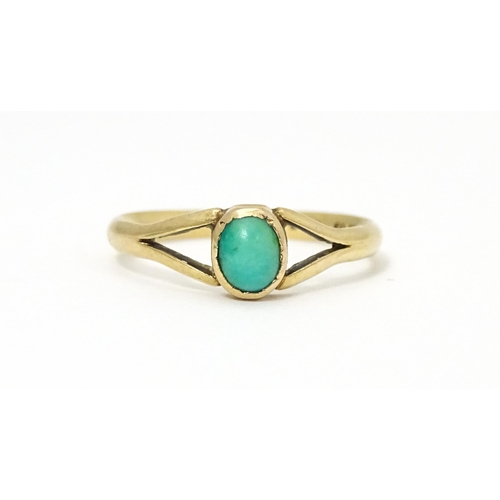 637 - A 9ct gold ring set with turquoise cabochon. Ring size approx. Q 1/2