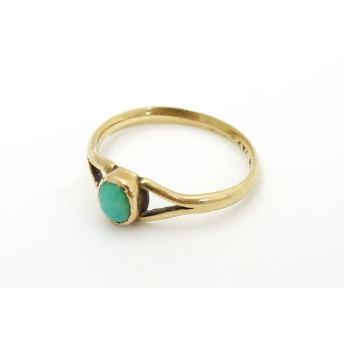 637 - A 9ct gold ring set with turquoise cabochon. Ring size approx. Q 1/2