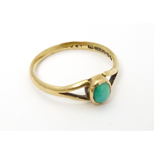 637 - A 9ct gold ring set with turquoise cabochon. Ring size approx. Q 1/2