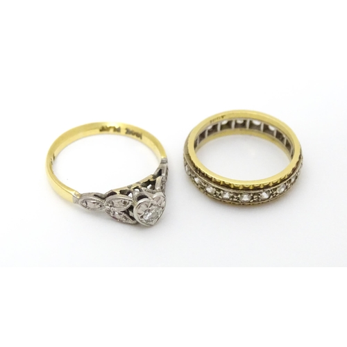 649 - An 18ct gold ring with platinum set central diamond in heart shaped setting. Ring size approx. J. To... 