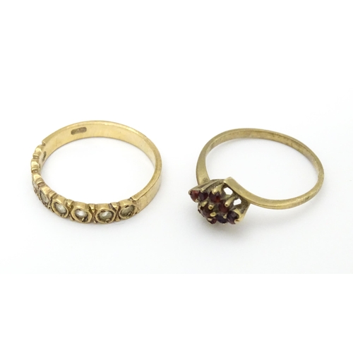 650 - A 9ct gold ring set with garnets. Ring size approx. Q. Together with a 9ct gold ring set with white ... 