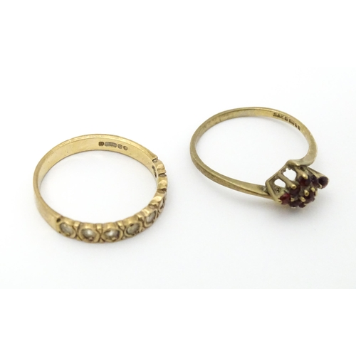 650 - A 9ct gold ring set with garnets. Ring size approx. Q. Together with a 9ct gold ring set with white ... 