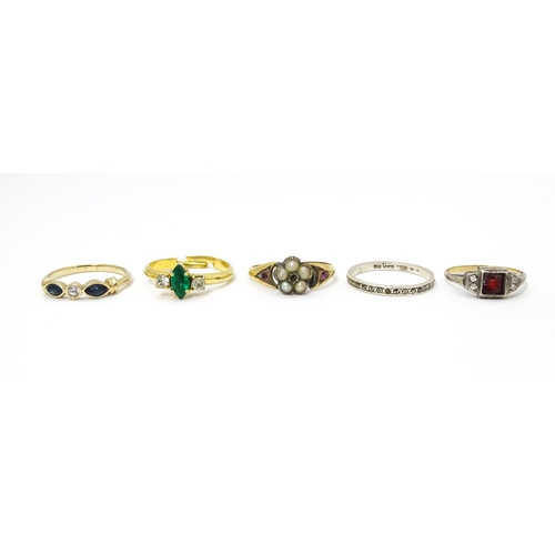 651 - Five assorted rings to include to include a silver and gold example (5)