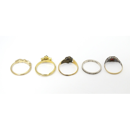 651 - Five assorted rings to include to include a silver and gold example (5)