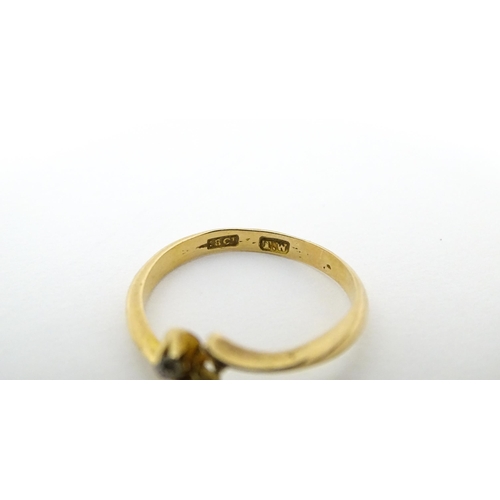 652 - Four assorted rings comprising three 9ct gold examples and a 18ct gold ring (4)