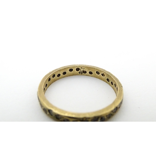 652 - Four assorted rings comprising three 9ct gold examples and a 18ct gold ring (4)