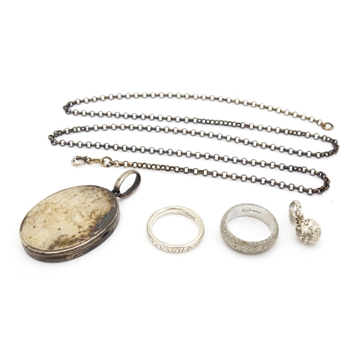 655 - Five items of assorted silver jewellery a Victorian pendant locket, a ring and pendant by Links of L... 