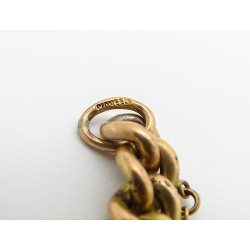 661 - A gold plated bracelet by Pioneer with patent no. 137868, with heart shaped padlock clasp.