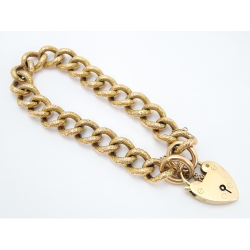 663 - A yellow metal bracelet with 9ct gold clasp of padlock form.