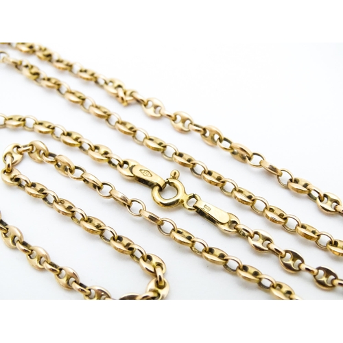 664 - A 9ct gold chain. Together with a yellow metal brooch set with moss agate. Chain approx. 18