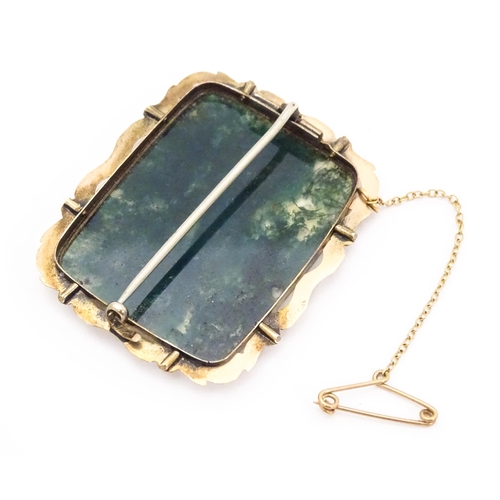 664 - A 9ct gold chain. Together with a yellow metal brooch set with moss agate. Chain approx. 18