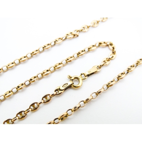 664 - A 9ct gold chain. Together with a yellow metal brooch set with moss agate. Chain approx. 18