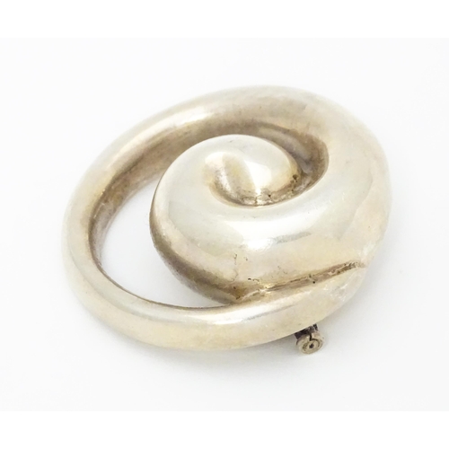 676 - A Bayanihan modernist silver brooch of swirl form. Approx. 2