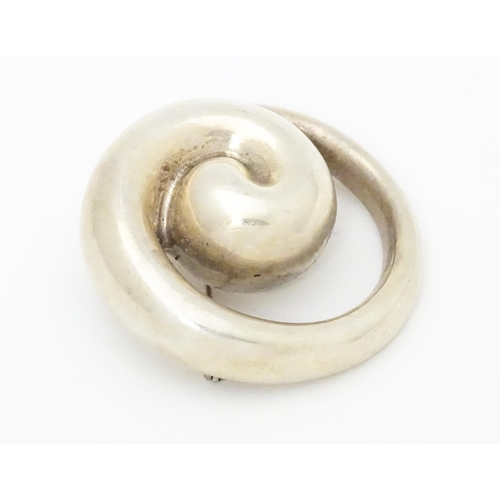 676 - A Bayanihan modernist silver brooch of swirl form. Approx. 2