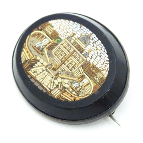 682 - A 19thC Grand Tour brooch with micro mosaic decoration depicting St Peter's Basilica. Approx. 1 3/4