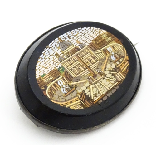 682 - A 19thC Grand Tour brooch with micro mosaic decoration depicting St Peter's Basilica. Approx. 1 3/4