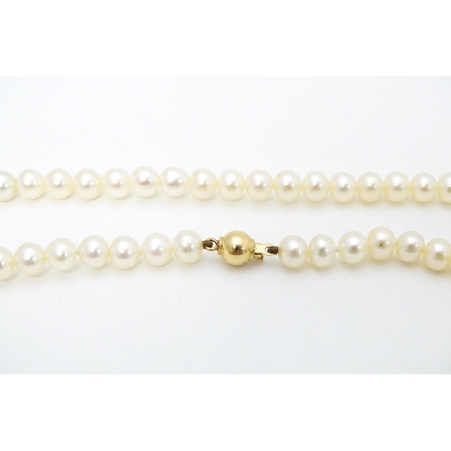 683 - A pearl necklace with 9ct gold clasp. Approx. 16