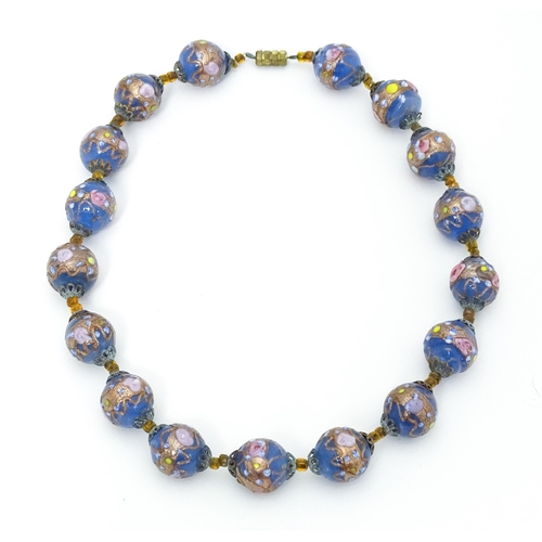 688 - A necklace of Venetian style glass beads. Approx. 16