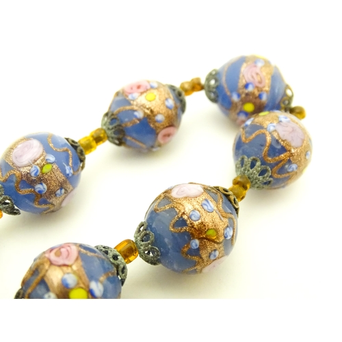 688 - A necklace of Venetian style glass beads. Approx. 16