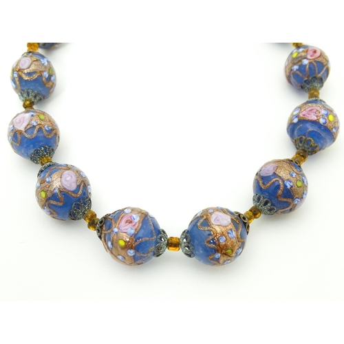 688 - A necklace of Venetian style glass beads. Approx. 16