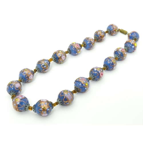 688 - A necklace of Venetian style glass beads. Approx. 16