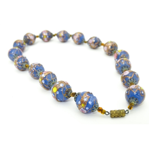 688 - A necklace of Venetian style glass beads. Approx. 16