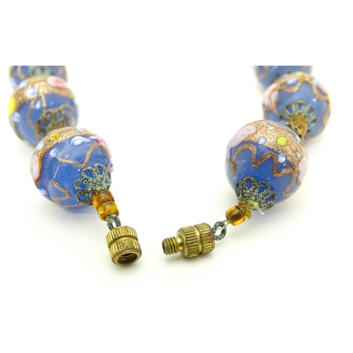 688 - A necklace of Venetian style glass beads. Approx. 16