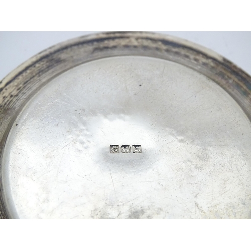 434 - An Egyptian silver pin dish together with a silver teaspoon hallmarked Sheffield 1930 and a white me... 