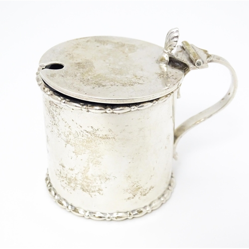 435 - A silver mustard pot with blue glass liner. Hallmarked Birmingham 1910 maker Elkington & Co Ltd. App... 