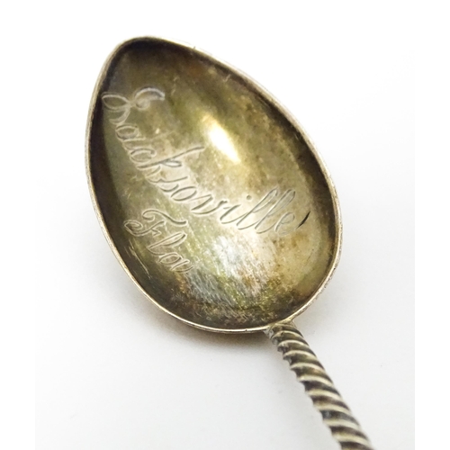 438 - Three silver teaspoons, one hallmarked Birmingham 1978, surmounted by a finial modelled as a turret ... 