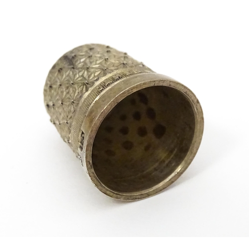 439 - Three thimbles to include two silver examples, one hallmarked Chester 1896 maker Henry Griffith & So... 