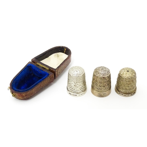 439 - Three thimbles to include two silver examples, one hallmarked Chester 1896 maker Henry Griffith & So... 