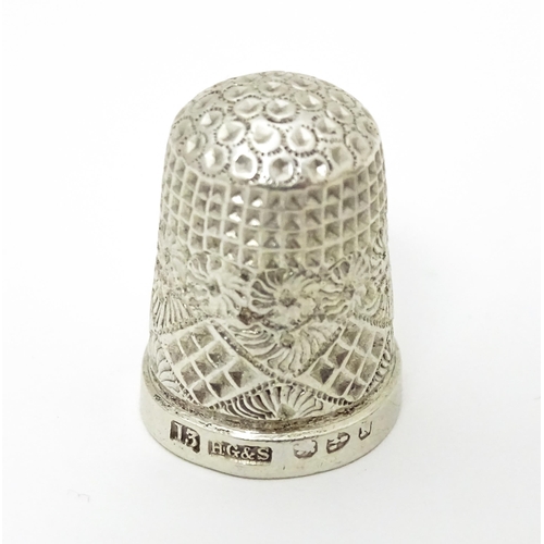 439 - Three thimbles to include two silver examples, one hallmarked Chester 1896 maker Henry Griffith & So... 